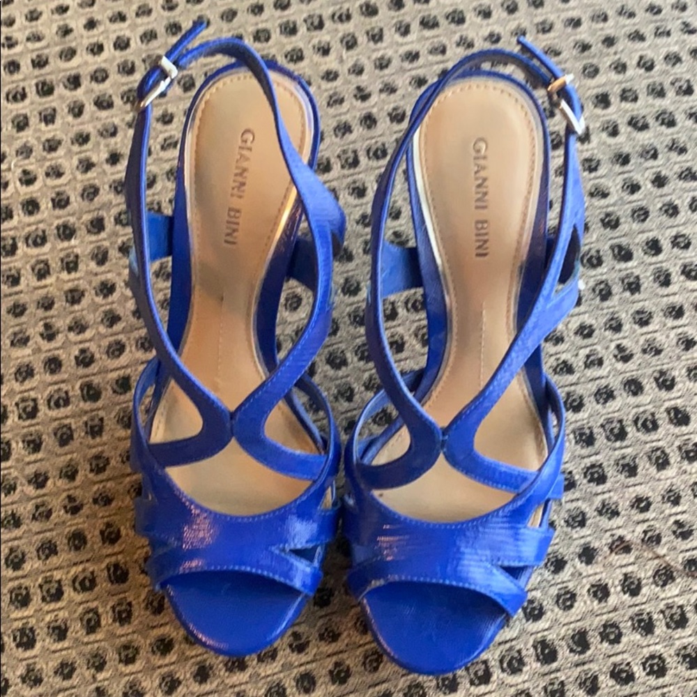 Gianni Bini platform heels with buckle closure.